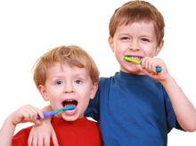 boys brushing their teeth